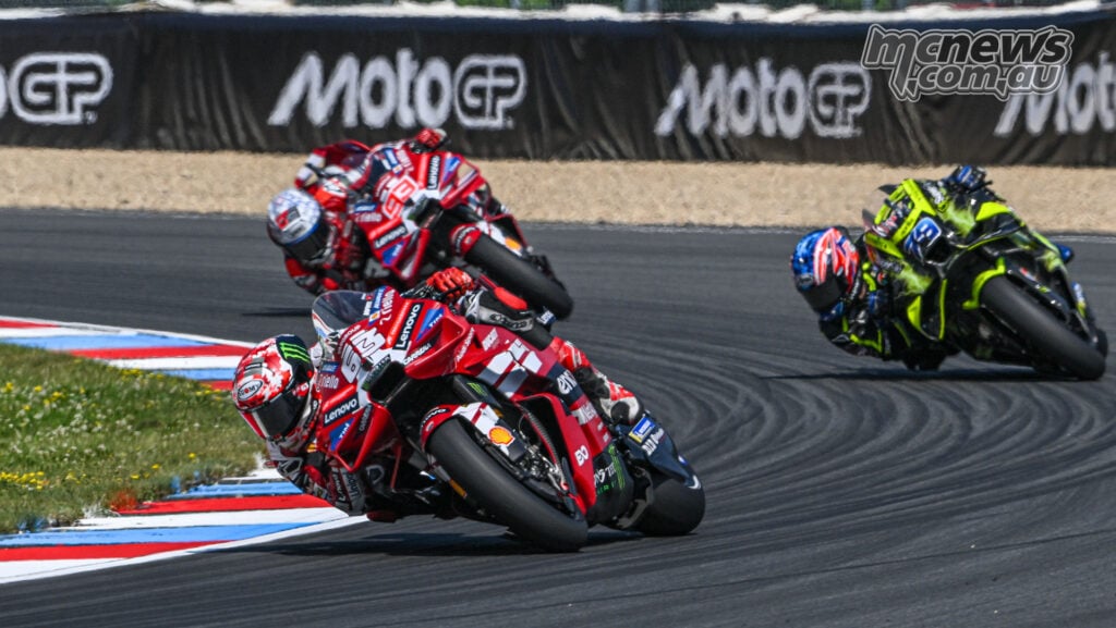 Francesco Bagnaia leads Marc Marquez and Ai Ogura during the MotoGP Sprint at Brno.