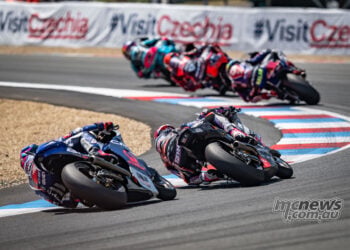 Rear view of the Moto2 pack racing through a right-hander at Brno