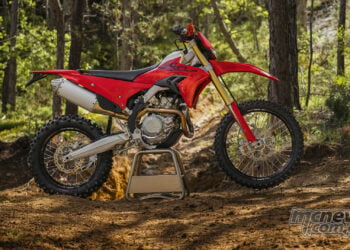 Ducati Desmo450 EDS full side profile in forest enduro setting