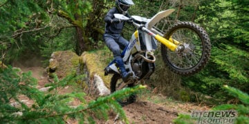 2027 Husqvarna FE enduro motorcycle climbing a rocky forest trail