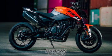 2027 KTM 790 Duke right-side static view in orange and black with exposed LC8c engine