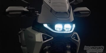 2027 Norton Atlas front view with LED twin projector headlights illuminated