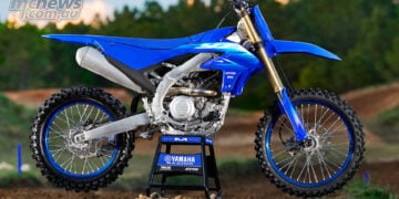 2027 Yamaha YZ250F static side view on a motocross track.