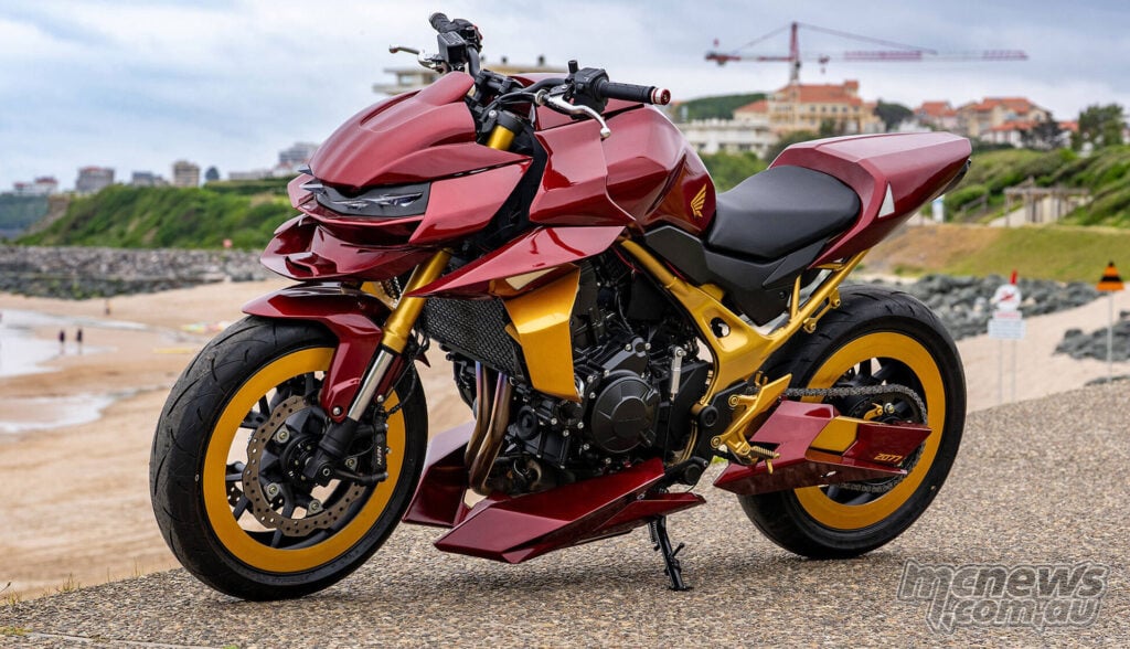 Front three-quarter view of Honda CB750 Hornet Concept 2077 custom with red bodywork and gold wheels