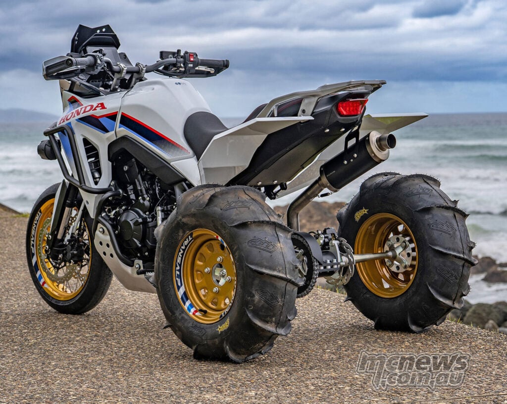 Rear three-quarter view of Honda XL750 Transalp ATC750 custom with twin rear tyres and gold wheels