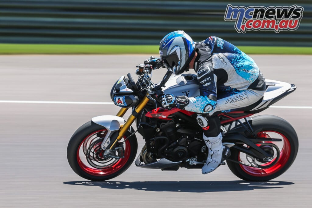 Triumph Street Triple 765 RX on track showing compact nakedbike riding position