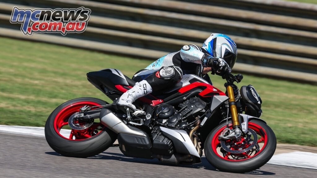 Triumph Street Triple 765 RX on track showing Brembo front brake hardware