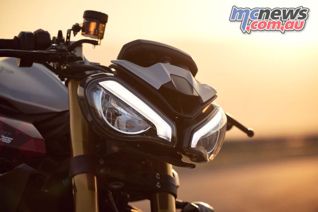 Close-up of Triumph Street Triple 765 RX twin headlights and small flyscreen