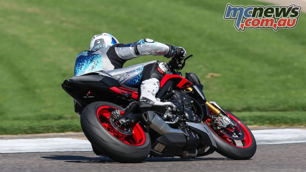Rear three-quarter view of Triumph Street Triple 765 RX cornering on track