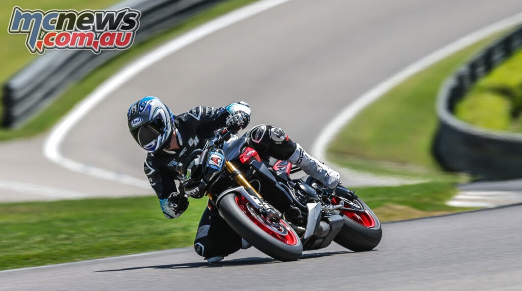 Triumph Street Triple 765 RX leaning through a corner at Barber Motorsports Park