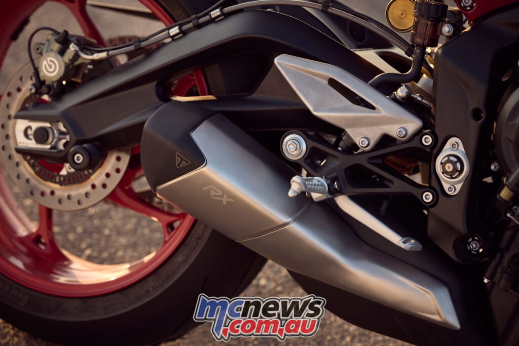 Close-up of Triumph Street Triple 765 RX underslung exhaust and rear wheel
