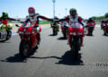 Riders on Ducati 916-era superbikes lead a group of Ducati motorcycles around Misano during World Ducati Week.