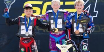 Simon Jul Vindum, Blake Schlein and Ryleigh McGregor stand together on the 2026 FIM SGP4 World Championship podium in Malilla.