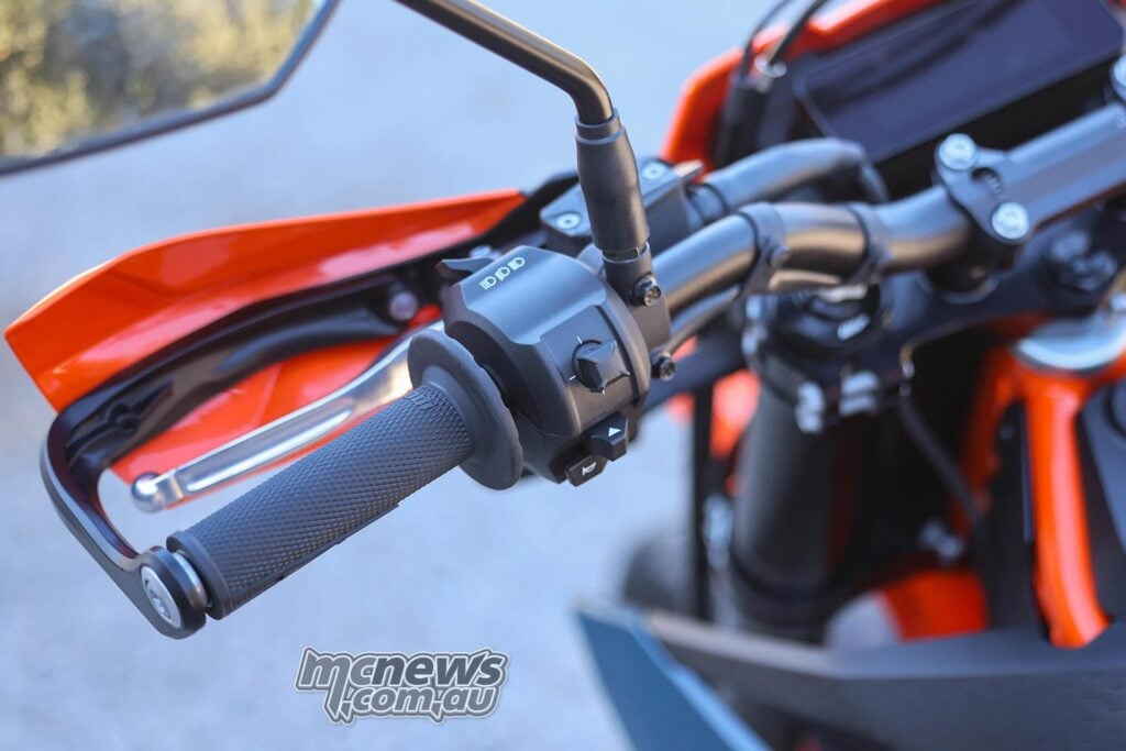 Close-up of the left handlebar switchgear, clutch lever and handguard on the KTM 690 SMC R.