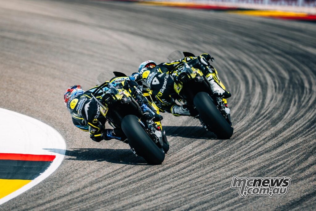 Raul Fernandez leads Ai Ogura through a long left-hand corner on the two Trackhouse Aprilia MotoGP bikes.