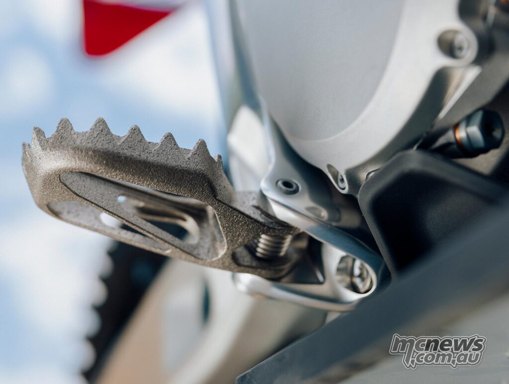 Close-up of the 3D-printed titanium footpegs on the Stark VARG Factory Edition.