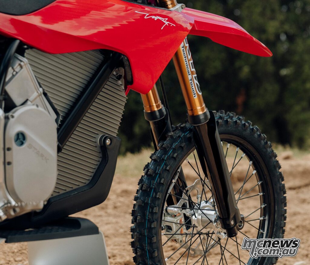 Detailed view of the KYB factory A-kit fork, front wheel and red bodywork on the Stark VARG MX.