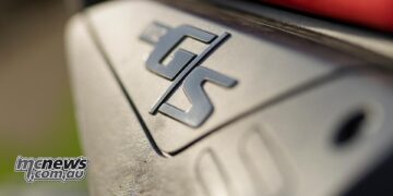 Close-up of the raised R 12 G/S badge on the side panel of the BMW GS Trophy Competition Bike.