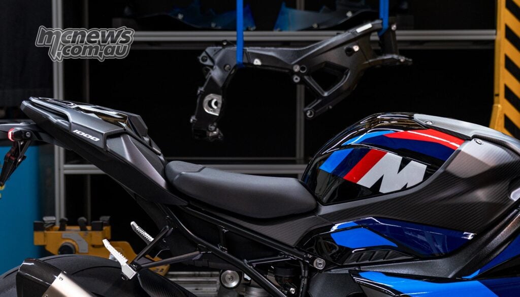 Close-up of the 2027 BMW M 1000 RR tail and tank with the new frame in the background.