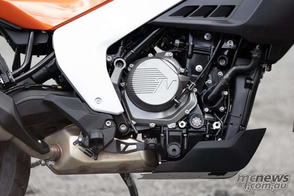 Right side of the Norton Atlas 585 cc parallel-twin engine and lower exhaust system.