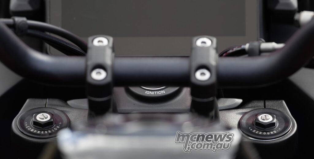 Close-up of the Norton Atlas KYB fork-top suspension adjusters.