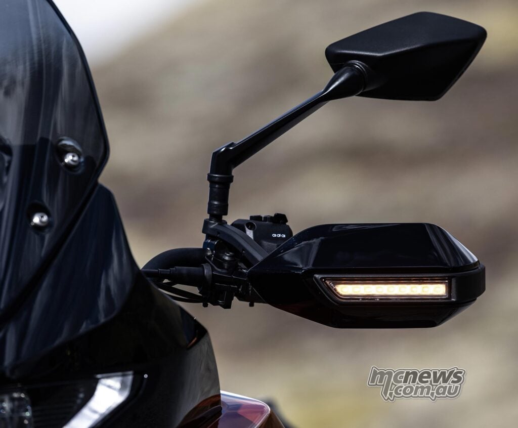 Norton Atlas handguard with integrated LED indicator and angular rear-view mirror.