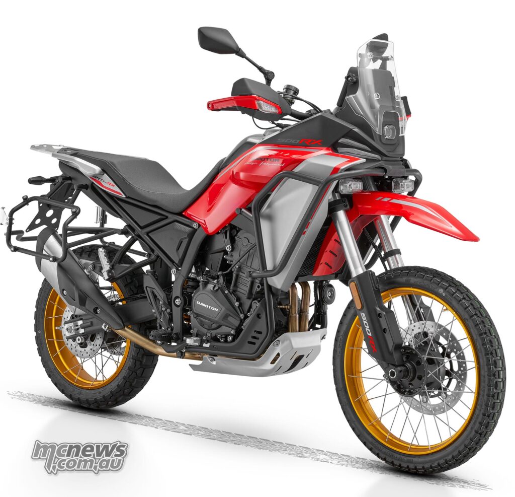 Red QJMOTOR RX adventure motorcycle with spoke wheels and rally-style bodywork.