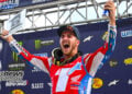 Hunter Lawrence celebrates on the Ironman podium while holding the 2026 450 Class champion number-one plate.