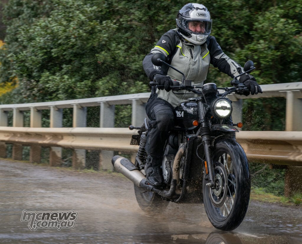 Trev riding a Raven Black BSA Scrambler 650 through wet conditions