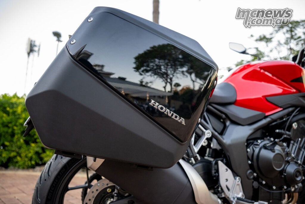 Honda CB1000GT showing its integrated pannier mounts and fitted side cases.