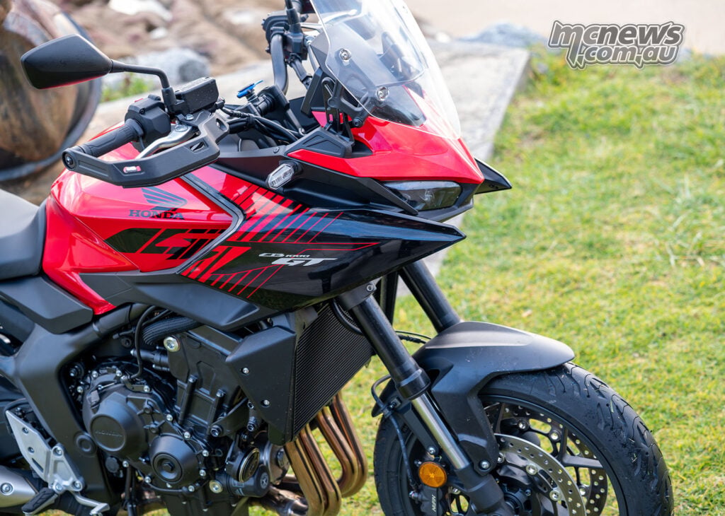 Close view of the Honda CB1000GT front fairing, windscreen, headlight, fork and brake.
