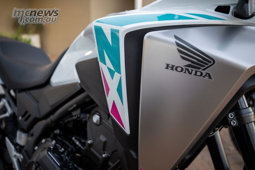 Close-up of the 2026 Honda NX500 graphics and Honda wing badge