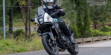 Trevor Hedge cornering a white 2026 Honda NX500 on a sealed road