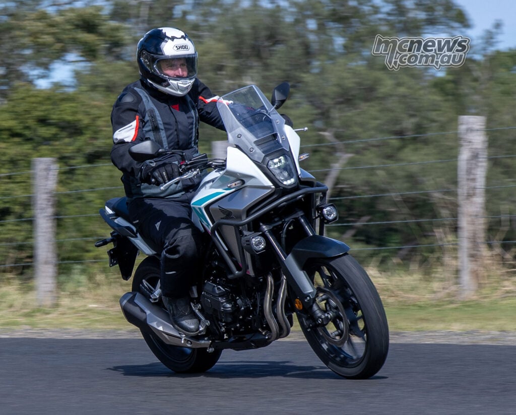 Trevor Hedge riding a white Honda NX500 E-Clutch towards the camera