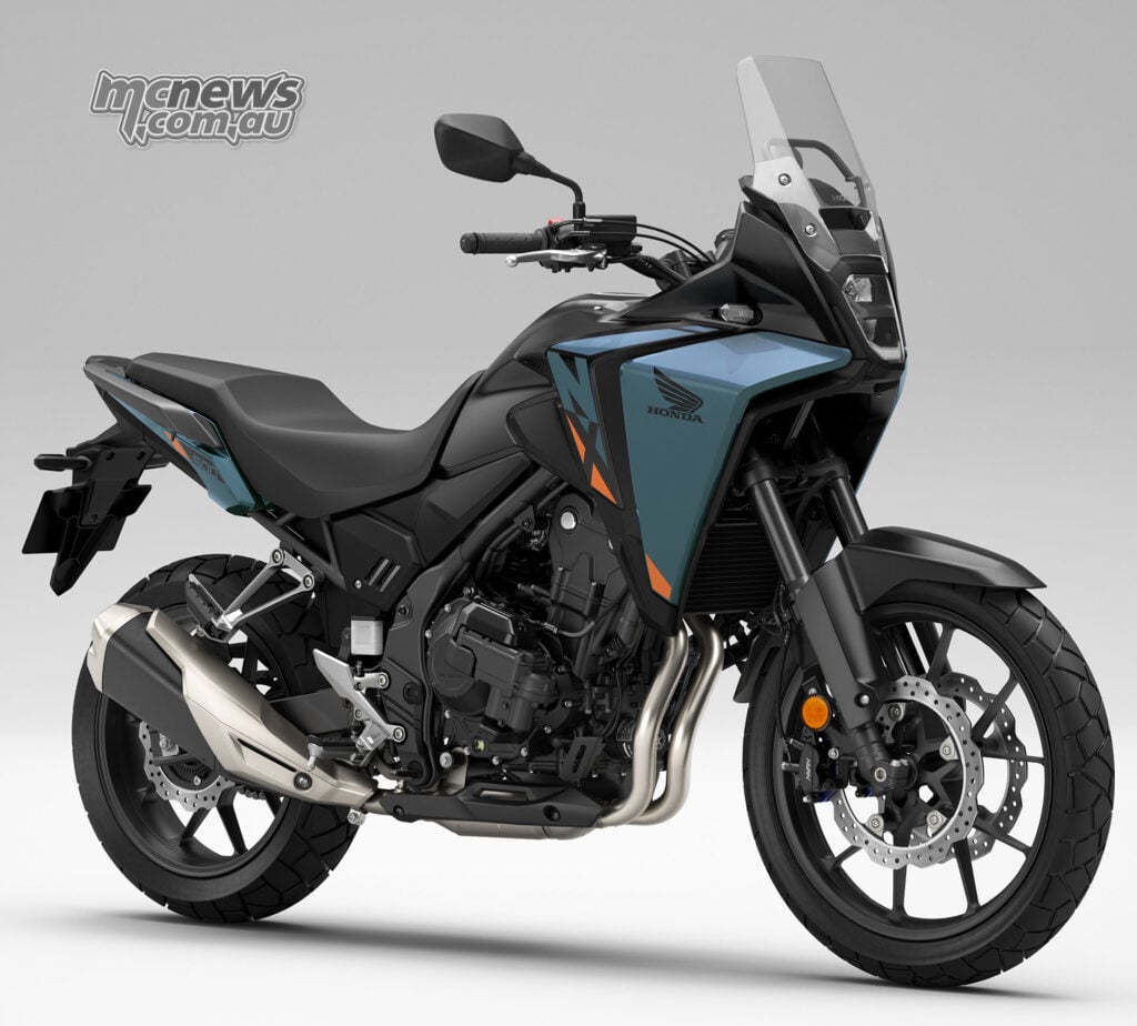 Dark blue and black 2026 Honda NX500 E-Clutch in a studio three-quarter view