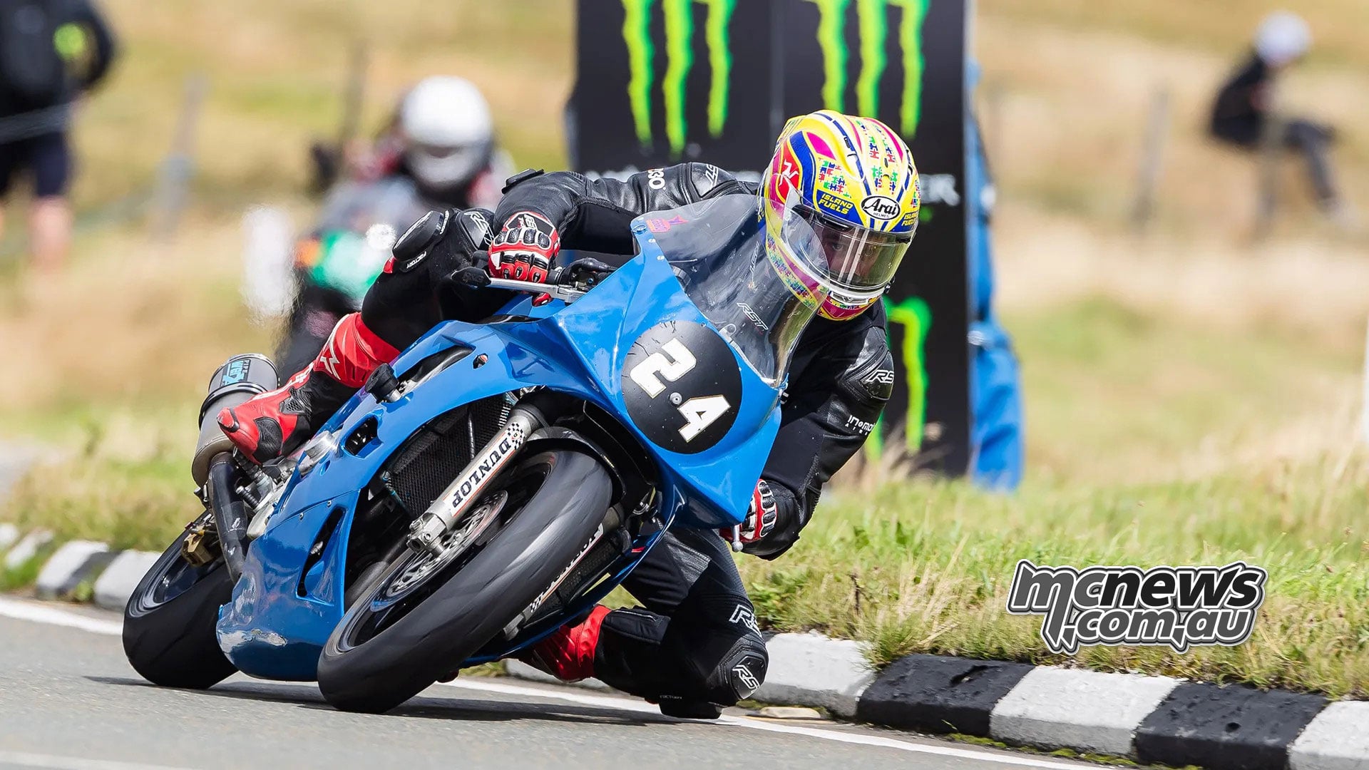 Paul Cassidy corners on his blue number 23 motorcycle during qualifying