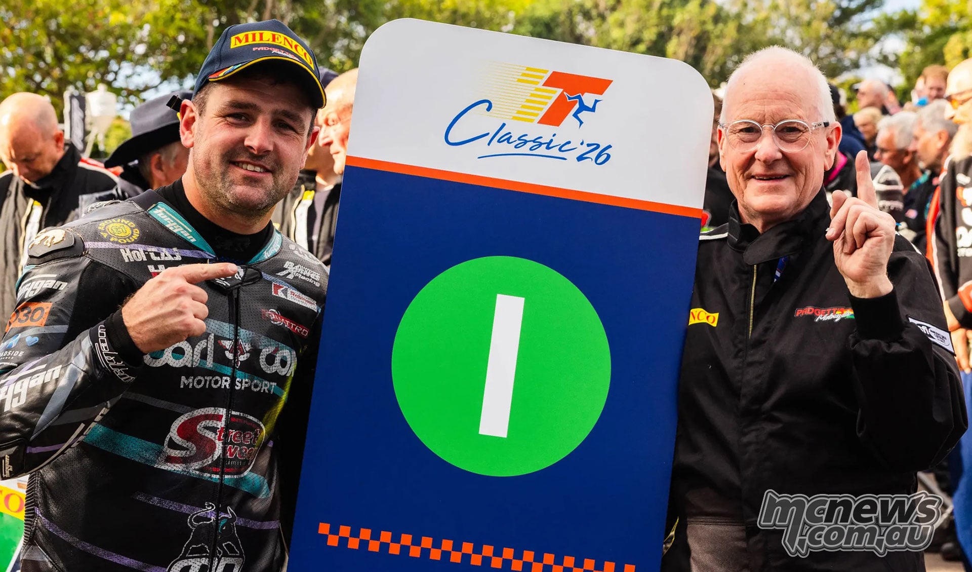 Michael Dunlop and Clive Padgett pose beside the Lightweight winner’s board
