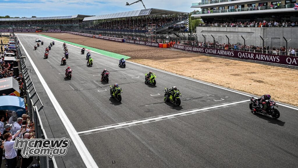 The MotoGP field accelerates away at the start of the 2026 British Grand Prix Sprint at Silverstone.
