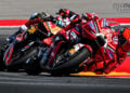 Marc Márquez on the Ducati races alongside Pedro Acosta on the KTM, with Marco Bezzecchi close behind at MotorLand Aragón.