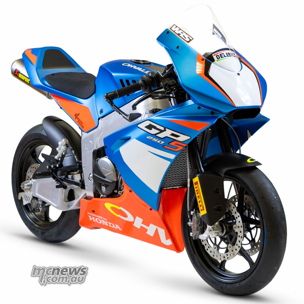 Blue and red Honda-powered Ohvale GP-5 250 viewed from the right front on a white background.