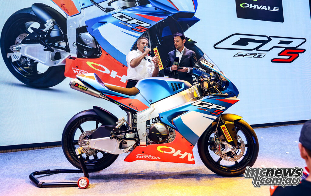Ohvale GP-5 250 displayed on stage during its Guangzhou unveiling with two presenters behind the motorcycle.
