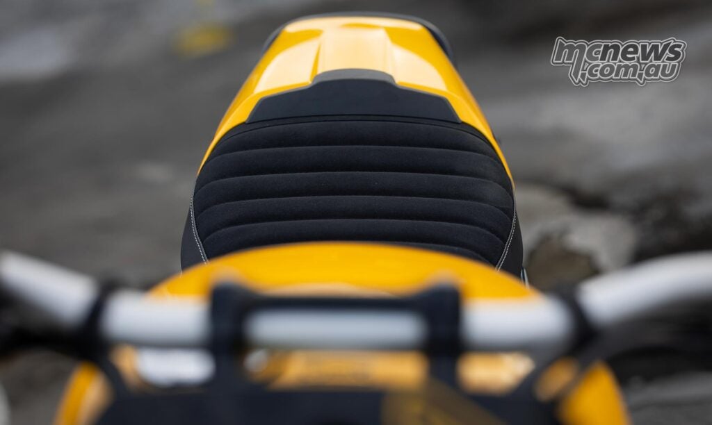 The Tracker bumps seat height up slightly at 805 mm to the Thruxton's 795 mm, with both narrow between the legs