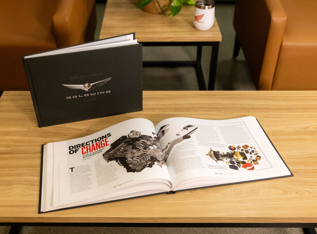 Honda Gold Wing 50th Anniversary coffee table book displayed open and closed on a table
