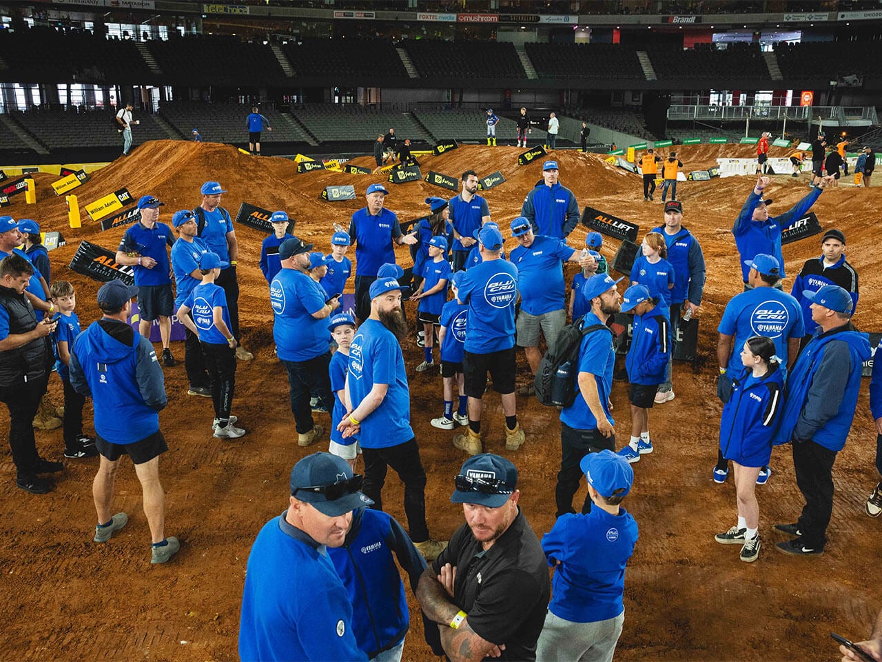 Yamaha YZ65 Cup riders, families and team members gathered for a group photograph on the track