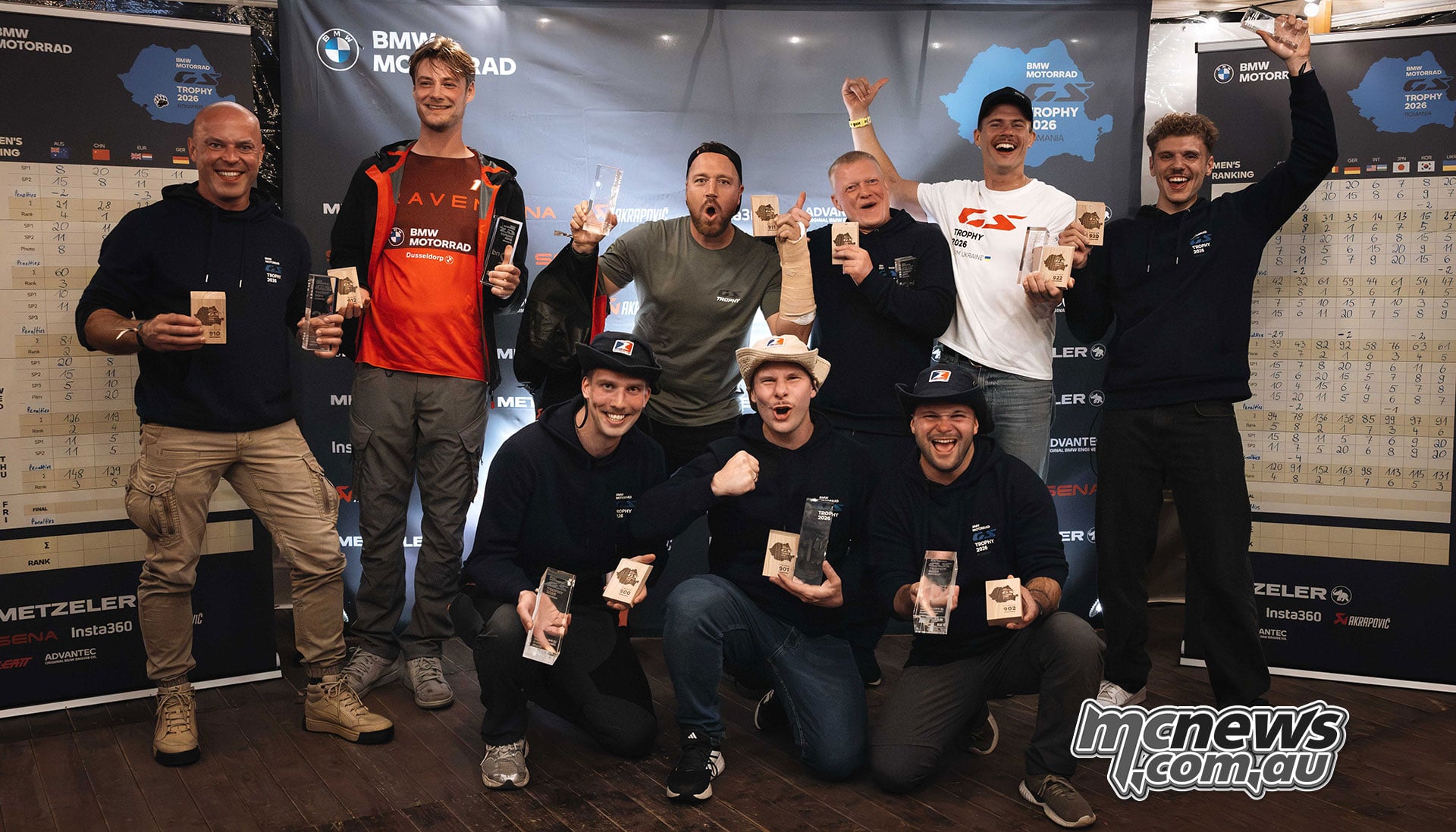 The men’s podium teams pose together with their awards at the 2026 BMW International GS Trophy presentation.