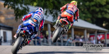 Rear view of Ryan Vickers airborne on the Honda with Bradley Ray following on the Yamaha at Cadwell Park.