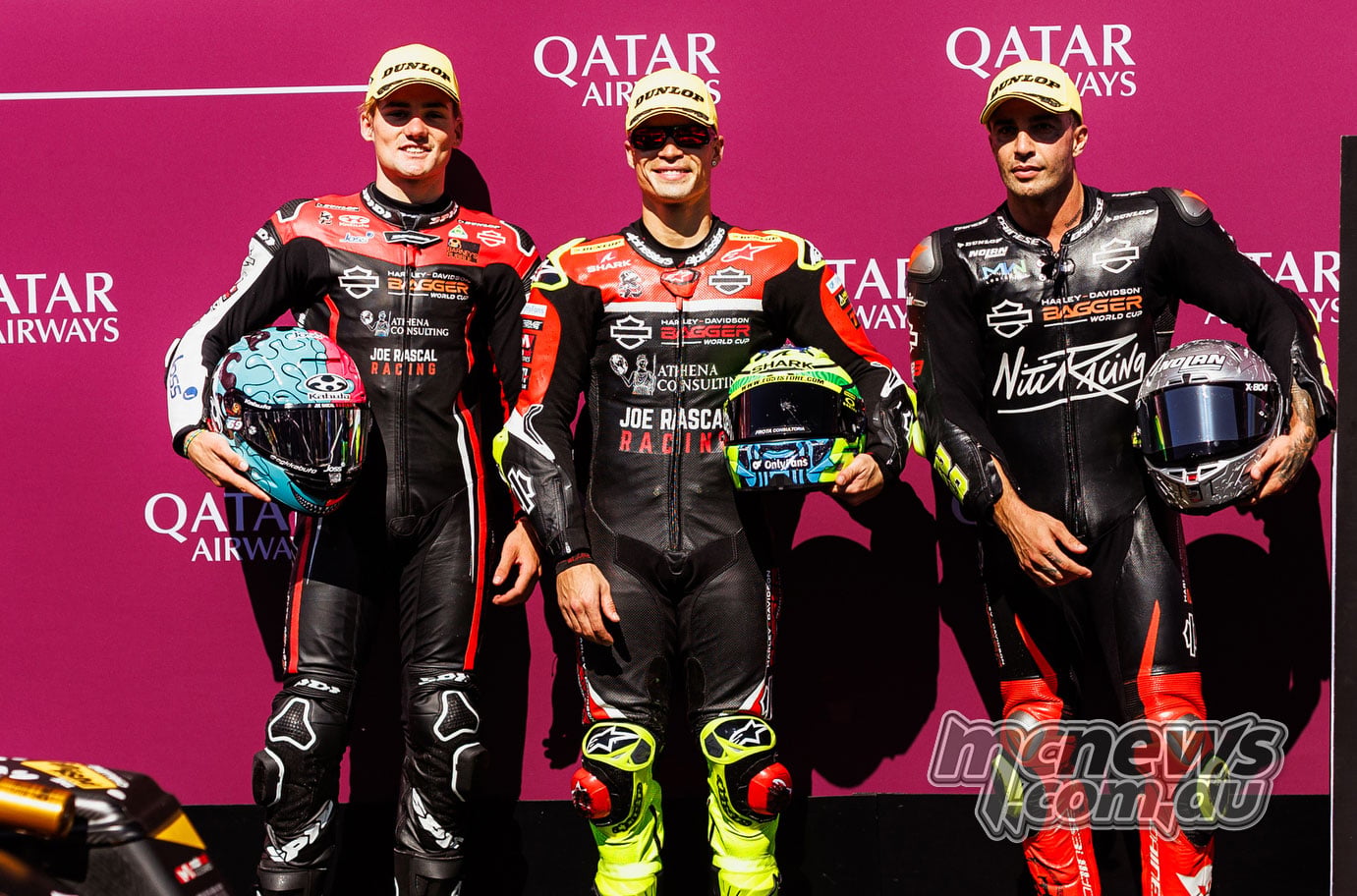 Archie McDonald, Eric Granado and Andrea Iannone, left to right, pose with their helmets after qualifying at the Red Bull Ring.