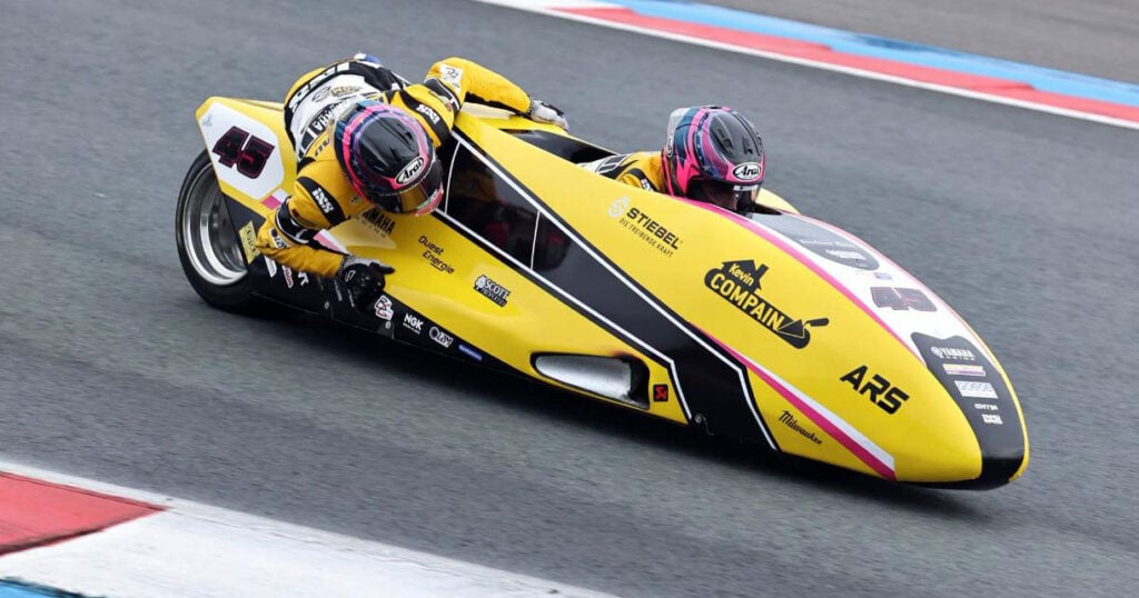 Harrison Payne and Kevin Rousseau cornering their yellow number 45 ARS Yamaha sidecar at TT Circuit Assen.