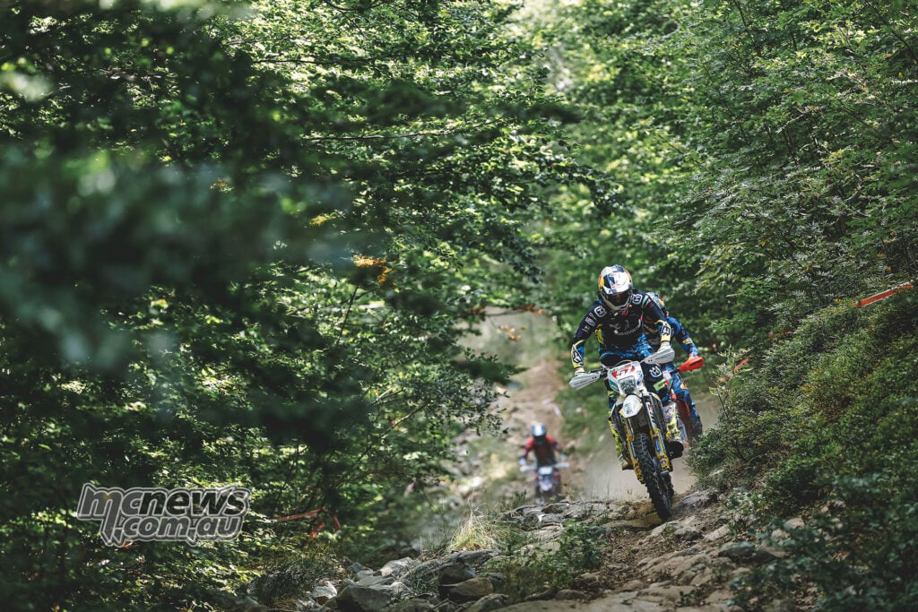 Billy Bolt riding his Husqvarna along a rocky forest trail during the Abestone Hard Enduro.