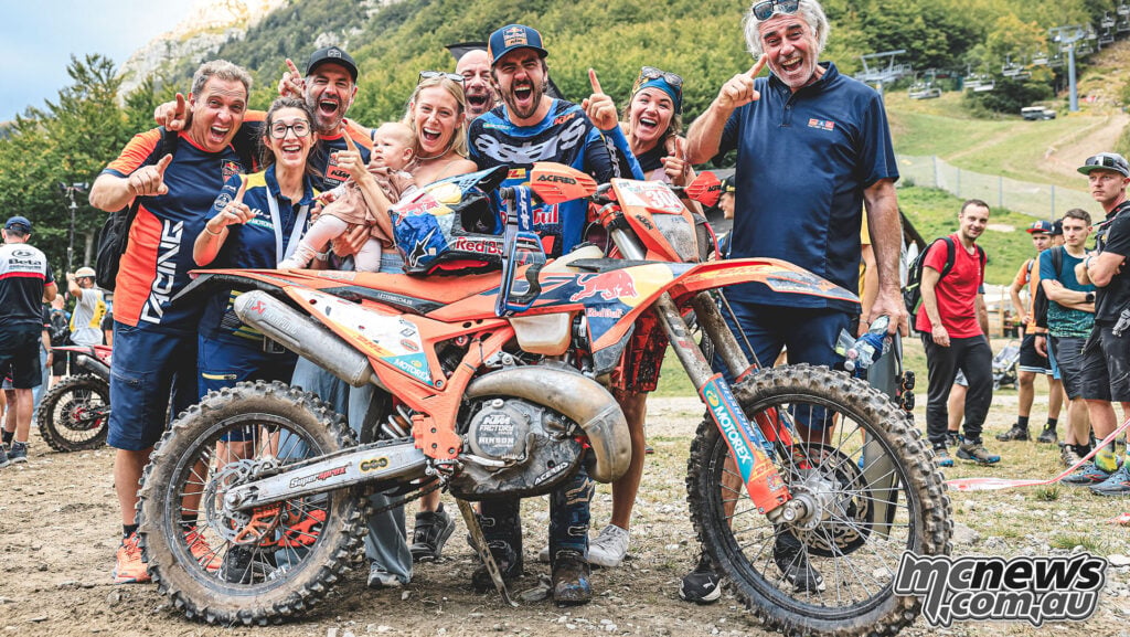 Manuel Lettenbichler and the Red Bull KTM team celebrating beside his KTM 300 EXC at Abestone.